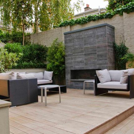Large BBQ Outdoor dining area low maintenance Cambridge Place Town House by Kate Gould bi-fold doors installation, garden decking design specialist in London.