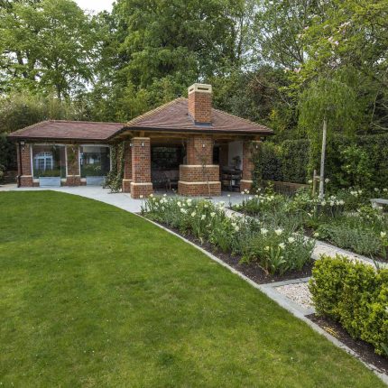 Large contemporary sophisticated garden elegant with multi-level features and staircases to the main terrace outdoor environment a stately, formal look feel.