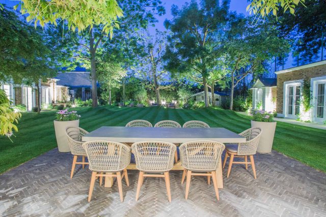 A grand residential garden in Fulham designed and built by The Garden Builders, a relaxing family garden, terrace for fun, outdoor entertainment space with lawn.