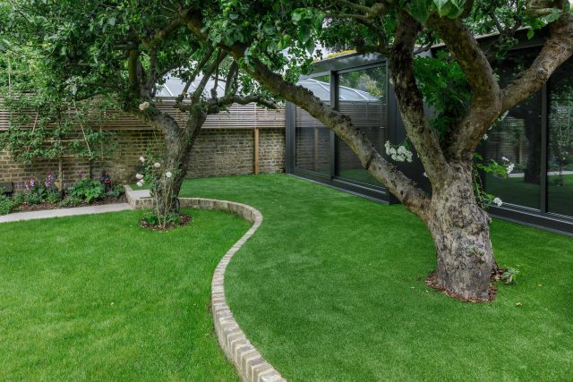Beautiful contemporary family garden in Kew designed by Maitanne Hunt, constructed by The Garden Builders, creates a spacious, relaxing environment for entertain.