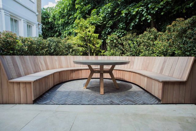 A grand residential garden in Fulham designed and built by The Garden Builders, a relaxing family garden, terrace for fun, outdoor entertainment space with lawn.