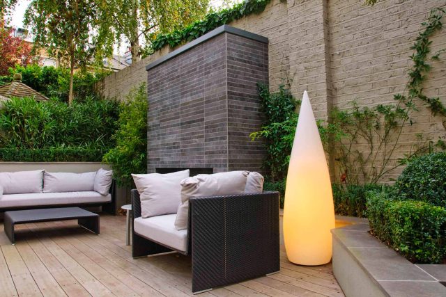 Large BBQ Outdoor dining area low maintenance Cambridge Place Town House by Kate Gould bi-fold doors installation, garden decking design specialist in London.