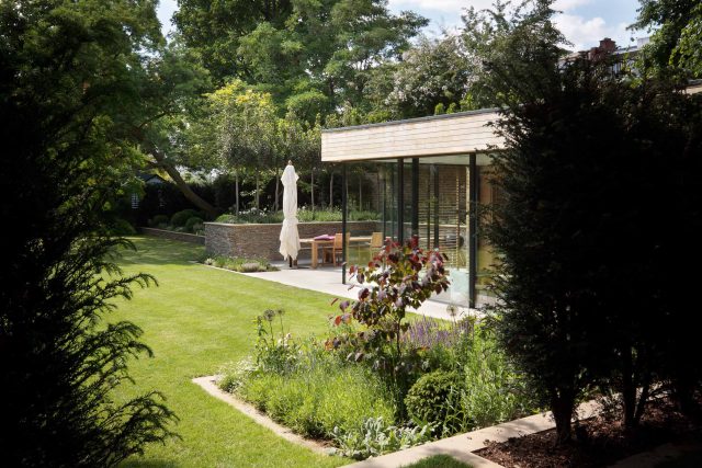 Large Grand Garden design includes York stone and wooden family pavilion in Notting Hill west London Landscape design company Ladbroke Grove Westbourne Grove.