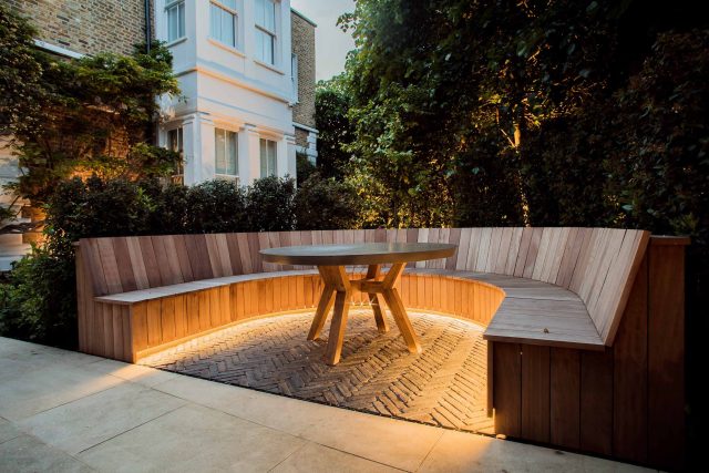 A grand residential garden in Fulham designed and built by The Garden Builders, a relaxing family garden, terrace for fun, outdoor entertainment space with lawn.