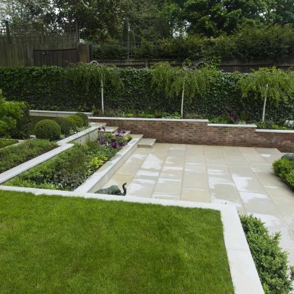 Contemporary landscaped large garden london with pre cast stone paving, led lighting and irrigation, elegant feature step, terrace and basement pool best design.
