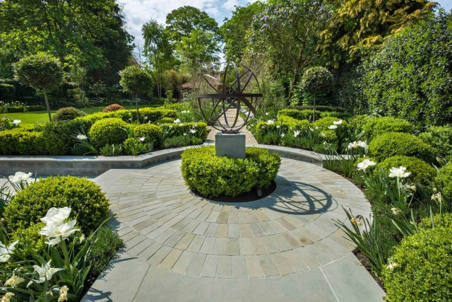 Large contemporary sophisticated garden elegant with multi-level features and staircases to the main terrace outdoor environment a stately, formal look feel.