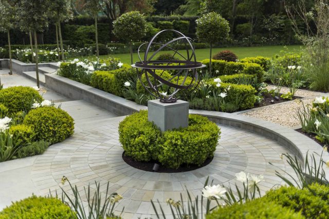 Large contemporary sophisticated garden elegant with multi-level features and staircases to the main terrace outdoor environment a stately, formal look feel.