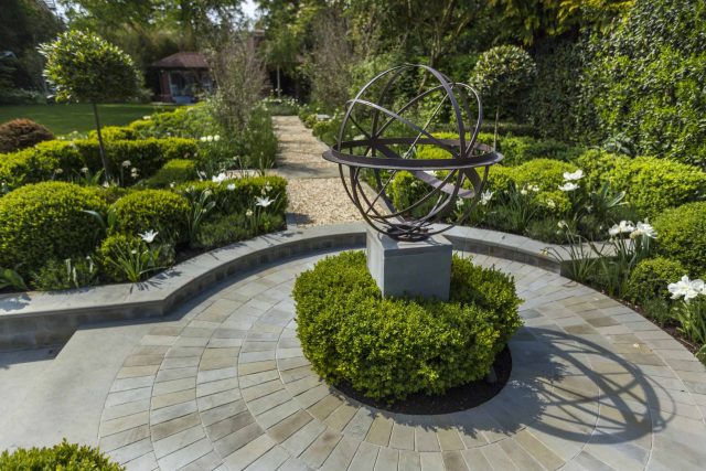 Large contemporary sophisticated garden elegant with multi-level features and staircases to the main terrace outdoor environment a stately, formal look feel.