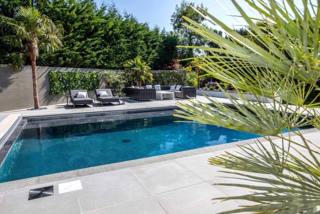 Oxshott Garden Designer Surrey stunning family garden with contemporary design, careful planting design was key to create the hidden feel to the pool designer.