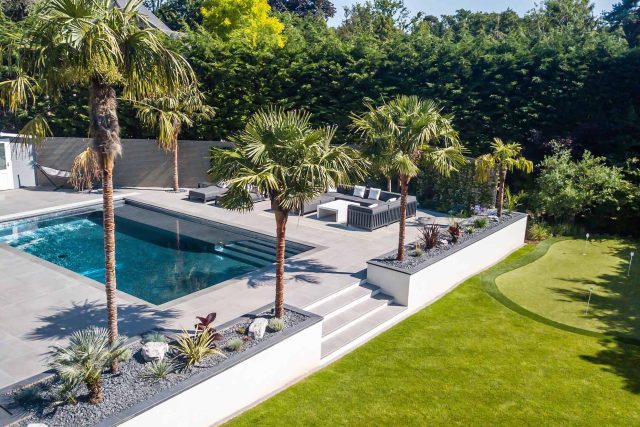 Oxshott Garden Designer Surrey stunning family garden with contemporary design, careful planting design was key to create the hidden feel to the pool designer.