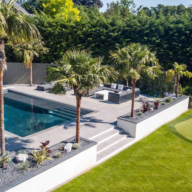 Oxshott Garden Designer Surrey stunning family garden with contemporary design, careful planting design was key to create the hidden feel to the pool designer.