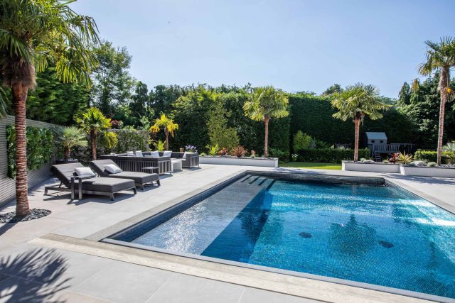 Oxshott Garden Designer Surrey stunning family garden with contemporary design, careful planting design was key to create the hidden feel to the pool designer.