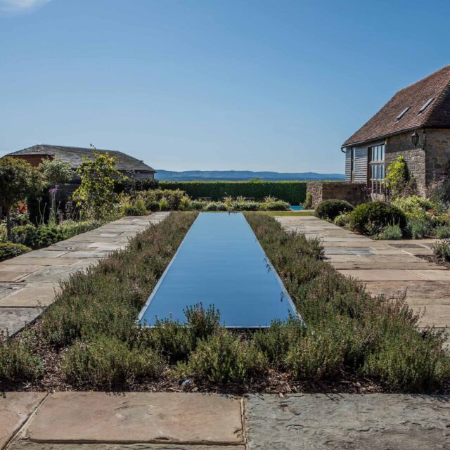 Petworth Garden Designer Sussex stunning countryside garden design York-stone sumptuous pathways house to the guest rooms importantly to the pool area & Croquet.
