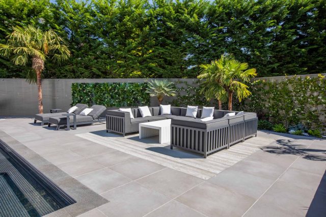 Oxshott Garden Designer Surrey stunning family garden with contemporary design, careful planting design was key to create the hidden feel to the pool designer.