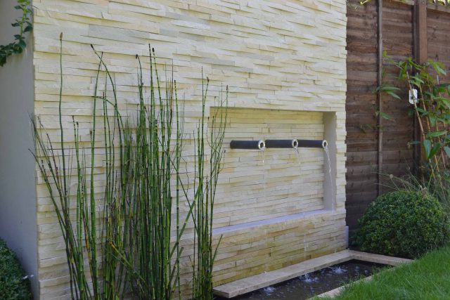 Lovely low maintenance family garden in Putney with raised bed for herbs and edible / culinary plants garden landscape design building company southwest London.