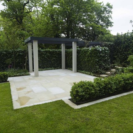 Contemporary landscaped large garden london with pre cast stone paving, led lighting and irrigation, elegant feature step, terrace and basement pool best design.