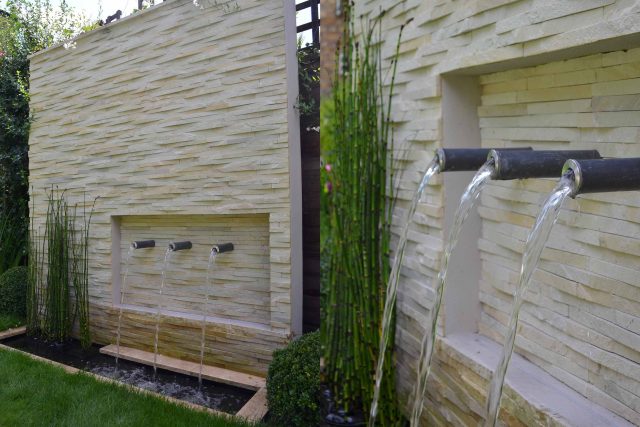 Lovely low maintenance family garden in Putney with raised bed for herbs and edible / culinary plants garden landscape design building company southwest London.
