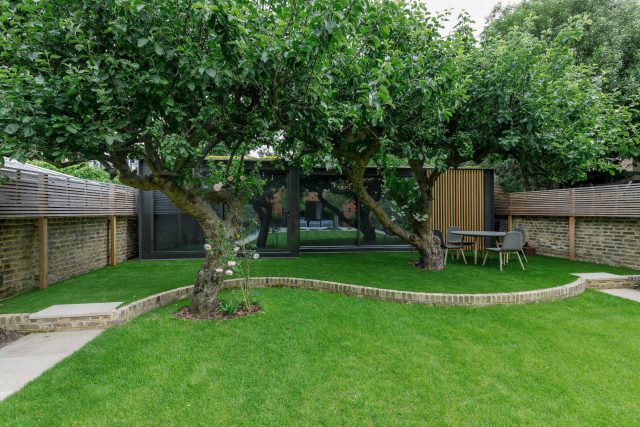 Beautiful contemporary family garden in Kew designed by Maitanne Hunt, constructed by The Garden Builders, creates a spacious, relaxing environment for entertain.