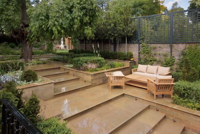 Large Grand Garden design includes York stone and wooden family pavilion in Notting Hill west London Landscape design company Ladbroke Grove Westbourne Grove.