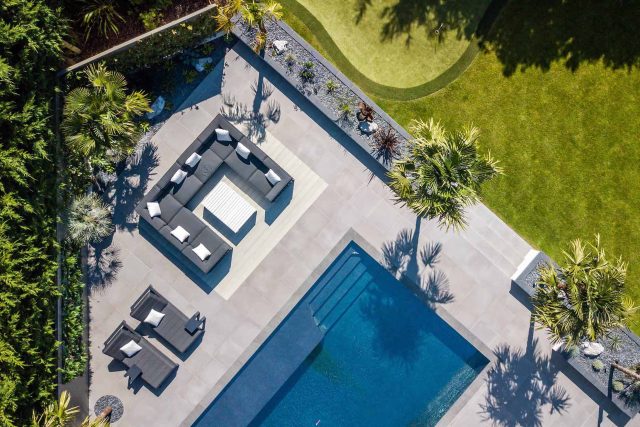 Oxshott Garden Designer Surrey stunning family garden with contemporary design, careful planting design was key to create the hidden feel to the pool designer.