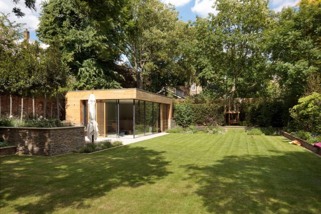 Large Grand Garden design includes York stone and wooden family pavilion in Notting Hill west London Landscape design company Ladbroke Grove Westbourne Grove.