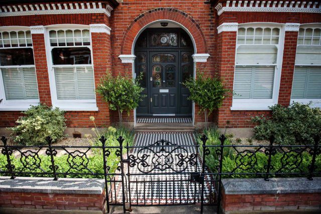 Garden with Stone terrace pathways in Wandsworth designed by Sarah Hammond constructed by the Garden Builders, classical high quality finish and low maintenance.