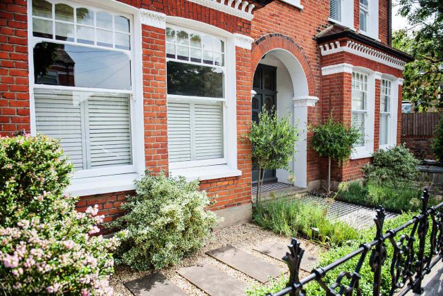 Garden with Stone terrace pathways in Wandsworth designed by Sarah Hammond constructed by the Garden Builders, classical high quality finish and low maintenance.