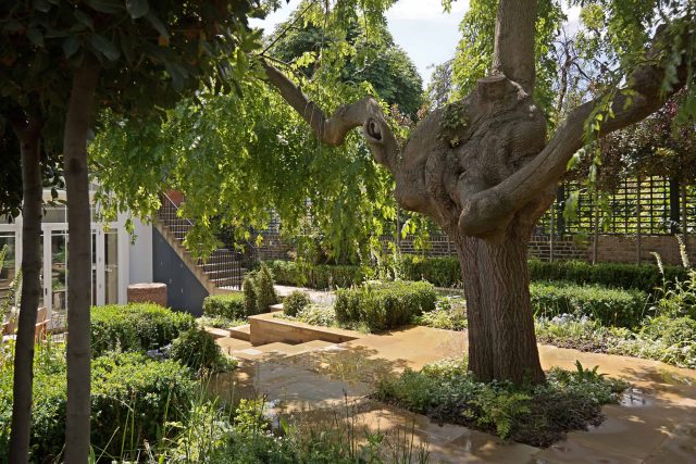 Large Grand Garden design includes York stone and wooden family pavilion in Notting Hill west London Landscape design company Ladbroke Grove Westbourne Grove.