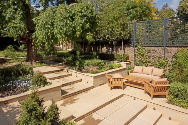 Large Grand Garden design includes York stone and wooden family pavilion in Notting Hill west London Landscape design company Ladbroke Grove Westbourne Grove.