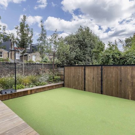 Garden designer contemporary family garden Chiswick friendly space decking, dining table, an aluminum pergola in powder-coated finish, a cozy and warm outlook.