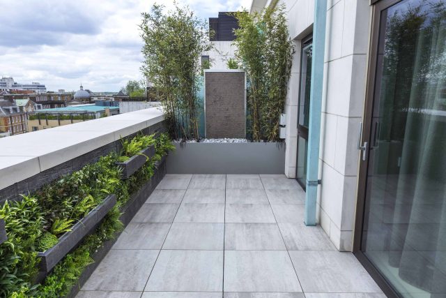 Roof Terrace Design St John's Wood London, by The Garden Buidlers artificial grass, artificial decking and cladding, roof garden to created sunset silhouettes.