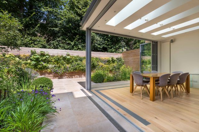Hardscaping design structure and contrast elements to the organic forms, and likewise provides continuity between the indoor and outdoor areas of the property.
