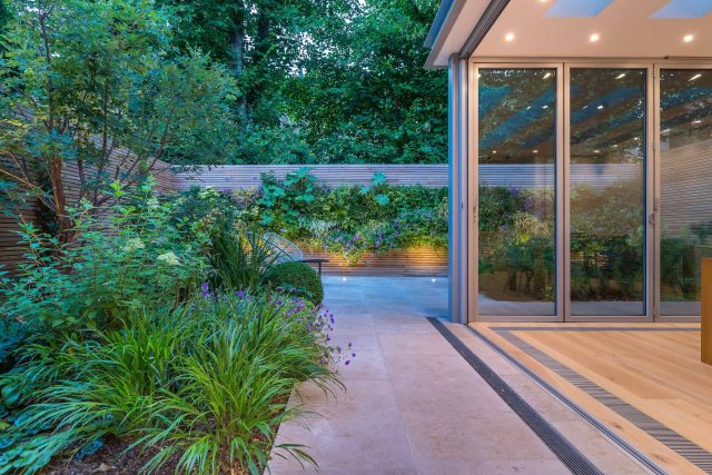 Hardscaping design structure and contrast elements to the organic forms, and likewise provides continuity between the indoor and outdoor areas of the property.