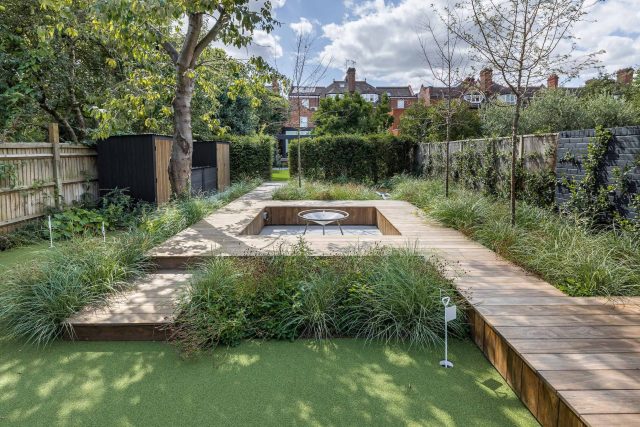 Garden designer contemporary family garden Chiswick friendly space decking, dining table, an aluminum pergola in powder-coated finish, a cozy and warm outlook.