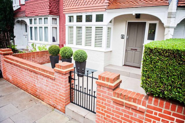 Beautiful London Garden, Clancarty Road, London, new block rendered boundary walls, planting, lighting, submersible water lights, bright contemporary effect.