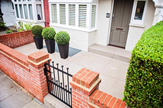 Beautiful London Garden, Clancarty Road, London, new block rendered boundary walls, planting, lighting, submersible water lights, bright contemporary effect.