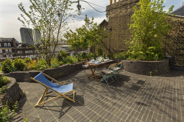 Marylebone London garden design by Todd Longstaff-Gowan and built by The Garden Buidlers brick patio drainage landscaping, planting with shrubs and climbers.