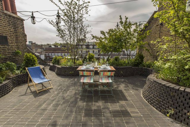 Marylebone London garden design by Todd Longstaff-Gowan and built by The Garden Buidlers brick patio drainage landscaping, planting with shrubs and climbers.