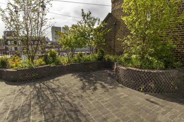 Marylebone London garden design by Todd Longstaff-Gowan and built by The Garden Buidlers brick patio drainage landscaping, planting with shrubs and climbers.