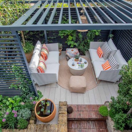 Greenwich Charlton Garden Design by The Garden Builders, outdoor lighting, Pergola structure, roof terrace building company in London top rated, Garden Room.