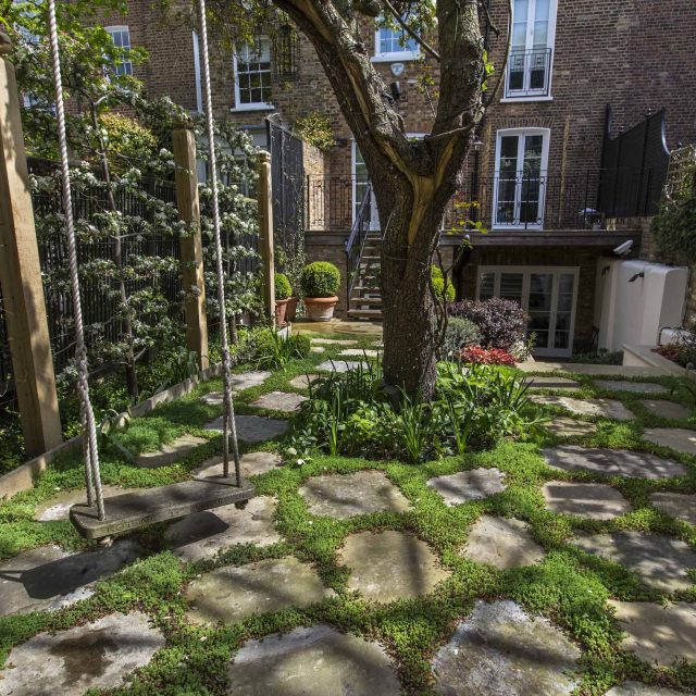 Inspirational city garden design in Holland Park London, Yorkstone stepping stones, oak posts architectural rythm to utilise lower terrace, near the basement.