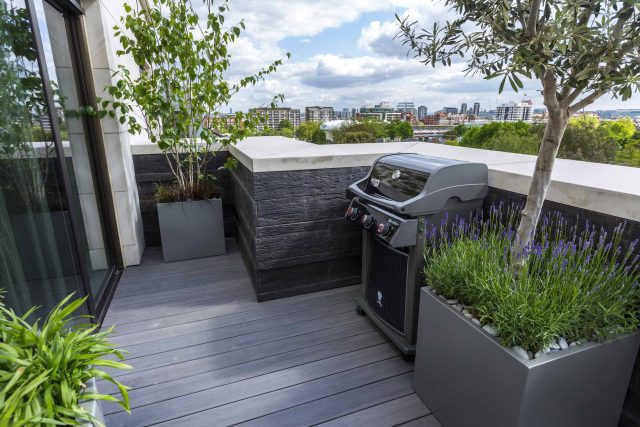 Roof Terrace Design St John's Wood London, by The Garden Buidlers artificial grass, artificial decking and cladding, roof garden to created sunset silhouettes.
