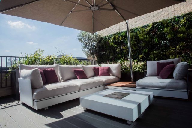 Roof terrace design Covent Garden composite decking luxurious entertaining in the heart of London with contemporary furniture a bio-fuel burning fire table.