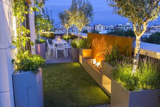 Roof Terrace Design St John's Wood London, by The Garden Buidlers artificial grass, artificial decking and cladding, roof garden to created sunset silhouettes.