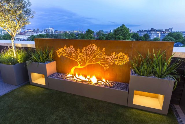 Roof Terrace Design St John's Wood London, by The Garden Buidlers artificial grass, artificial decking and cladding, roof garden to created sunset silhouettes.