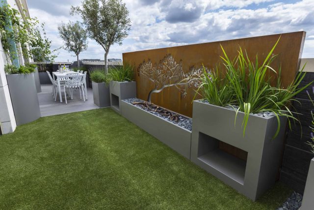 Roof Terrace Design St John's Wood London, by The Garden Buidlers artificial grass, artificial decking and cladding, roof garden to created sunset silhouettes.