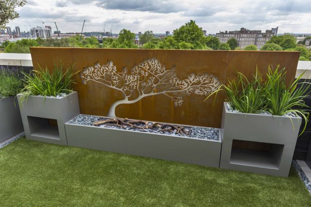 Roof Terrace Design St John's Wood London, by The Garden Buidlers artificial grass, artificial decking and cladding, roof garden to created sunset silhouettes.