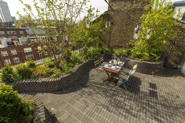 Marylebone London garden design by Todd Longstaff-Gowan and built by The Garden Buidlers brick patio drainage landscaping, planting with shrubs and climbers.