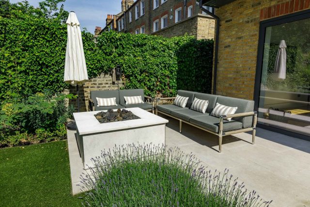 Elegant Family Garden design Tooting Bec contemporary style family friendly garden with kids play area, includes a variety of shrub and architectural planting.