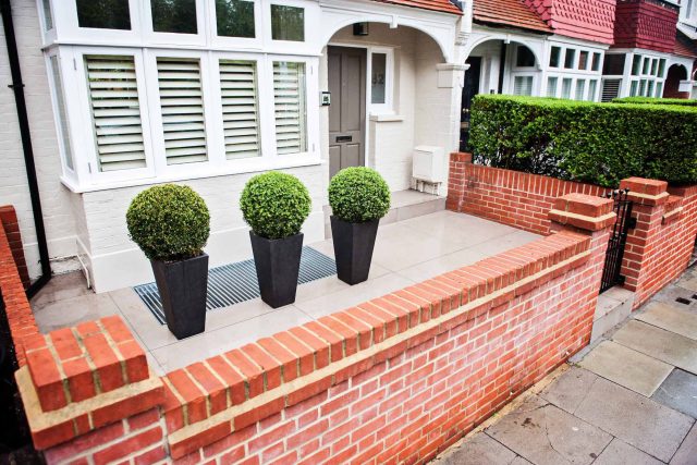 Beautiful London Garden, Clancarty Road, London, new block rendered boundary walls, planting, lighting, submersible water lights, bright contemporary effect.